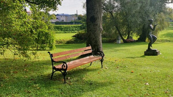 outdoor iron bench in nature