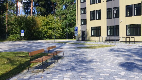 outdoor seating in front of a multi-storey building