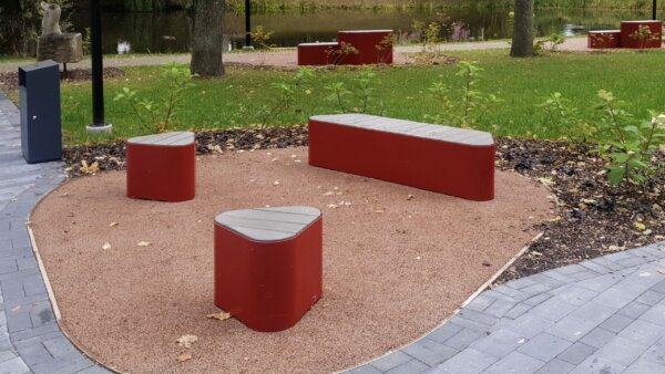 Multiple different size park benches in the park