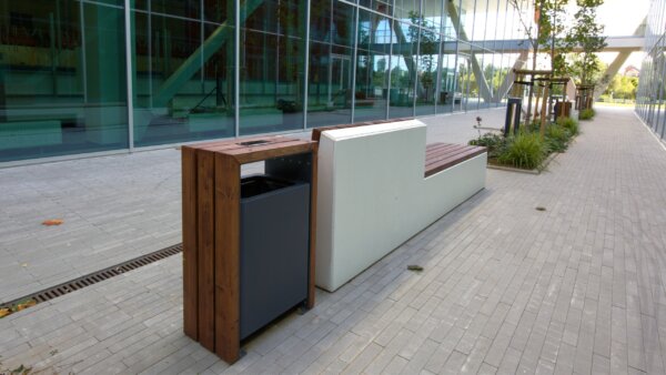 a wooden frame waste bin in an urban environment